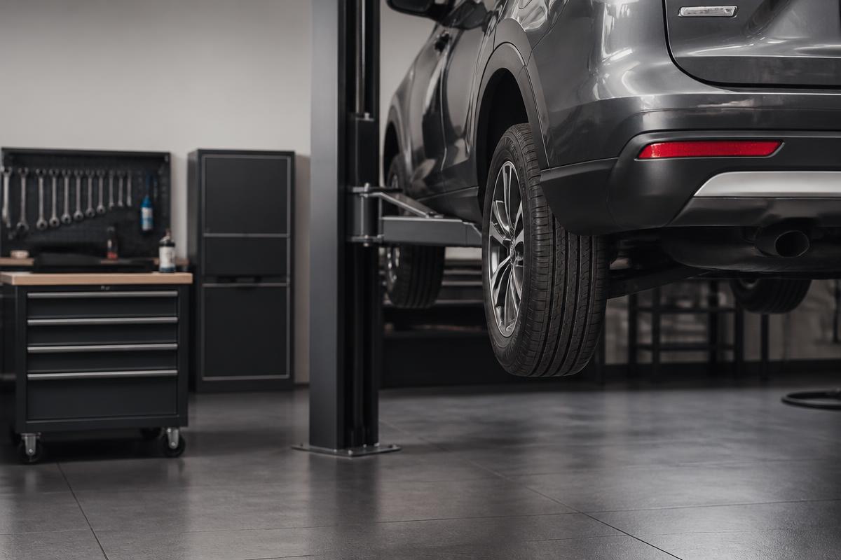Clean, organized licensed and insured auto repair service bay with professional equipment