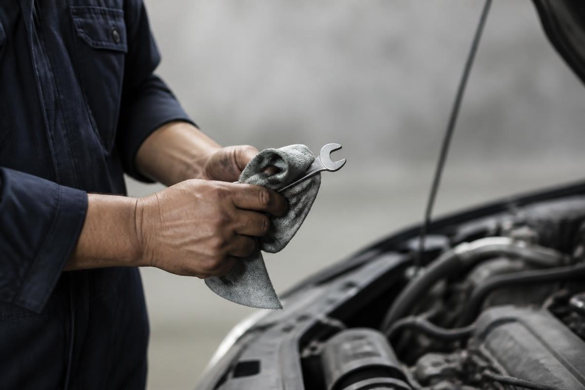 Experienced technician performing hands-on automotive work in the Wappingers Falls shop