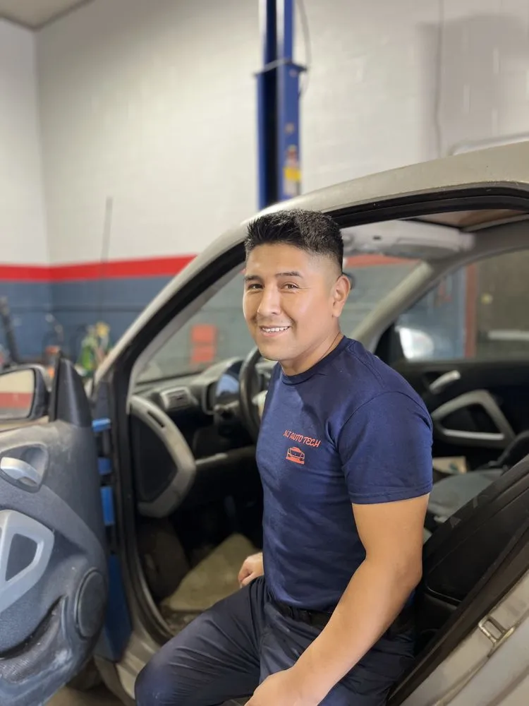 Auto mechanic working on a customer vehicle at NJ Auto Tech Automotive Specialist