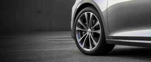 Working auto repair shop with tool bench, tire machine and a car on a lift in Wappingers Falls, NY